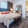 bedroom with bed and mirror