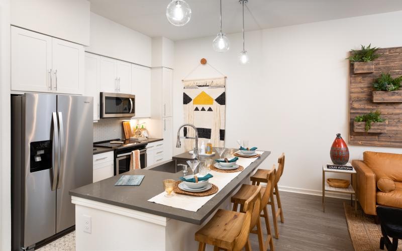 a kitchen with a table and chairs